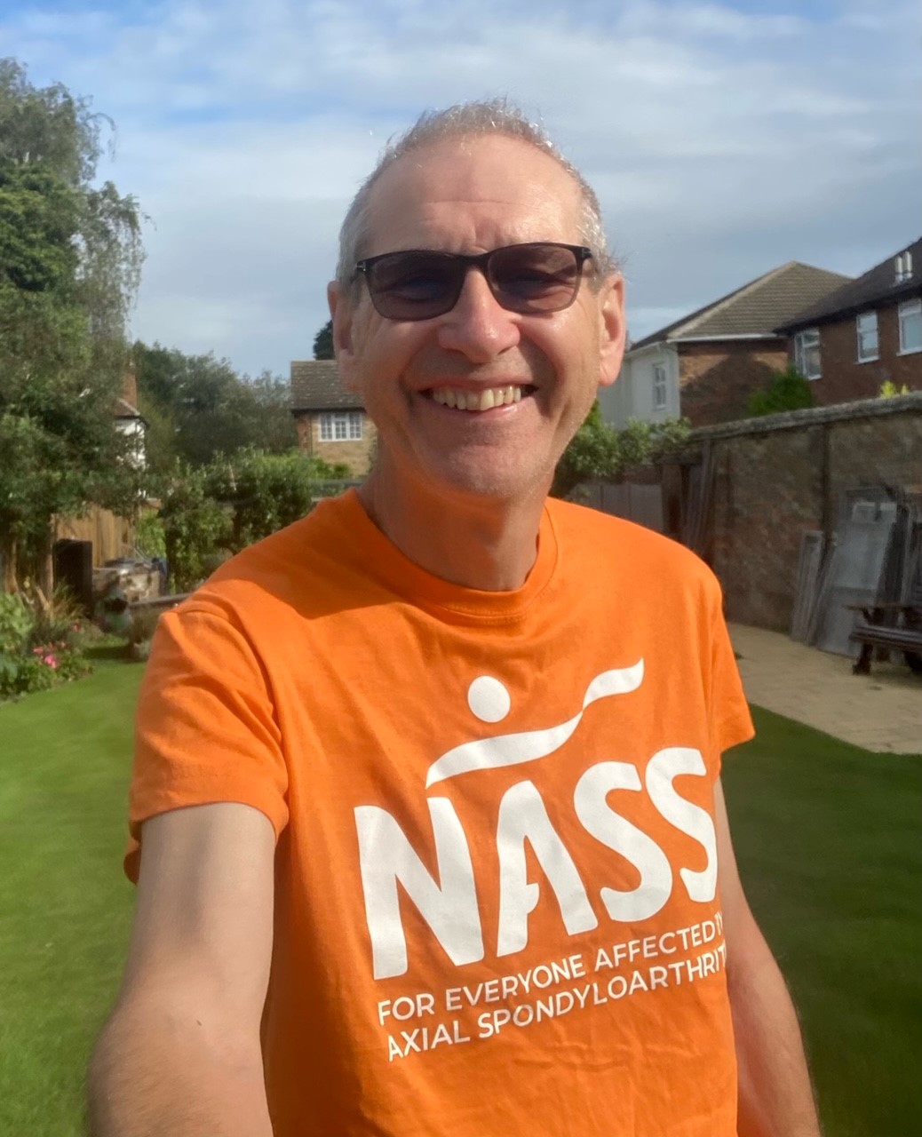 Nick Peace wearing an orange NASS T-shirt