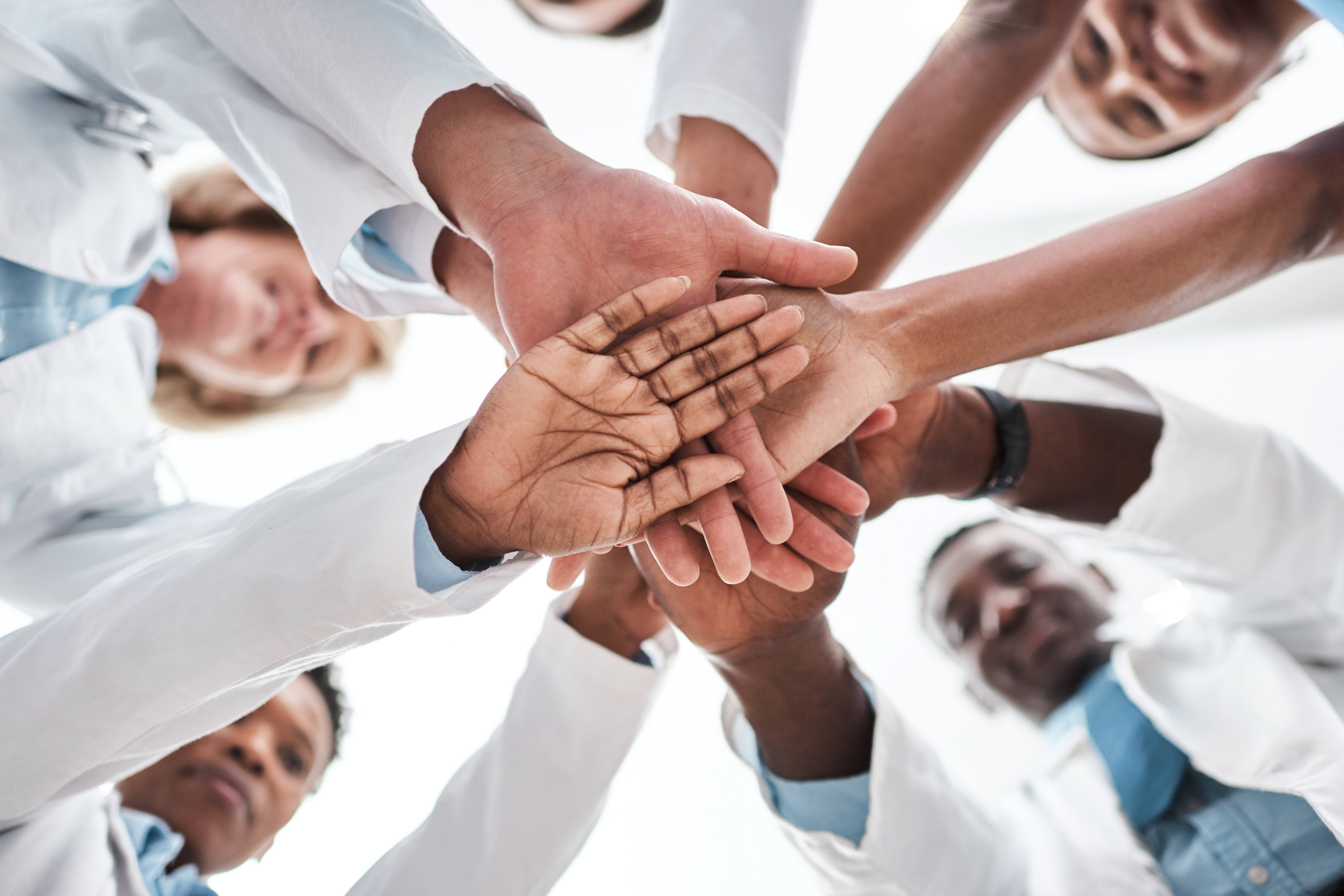 a group of healthcare professionals in a circle